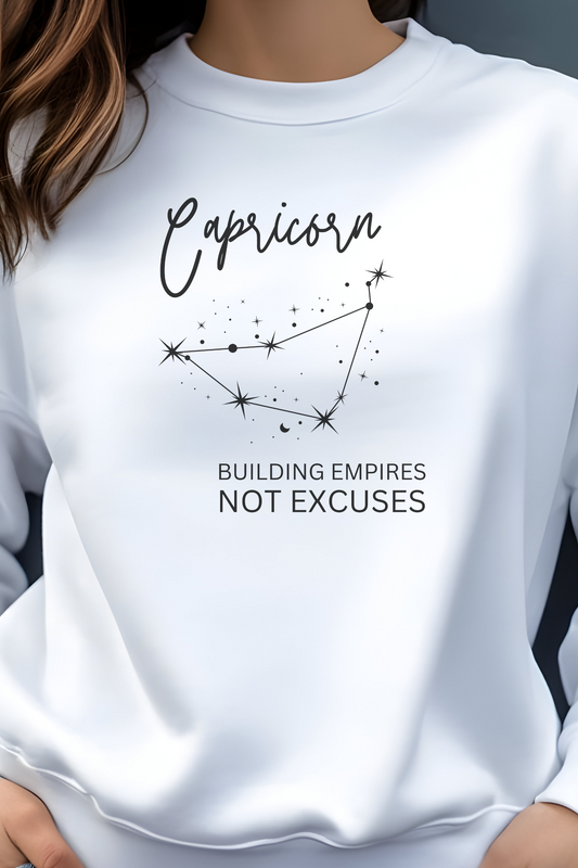 White sweatshirt with Capricorn zodiac design and text on a plain background