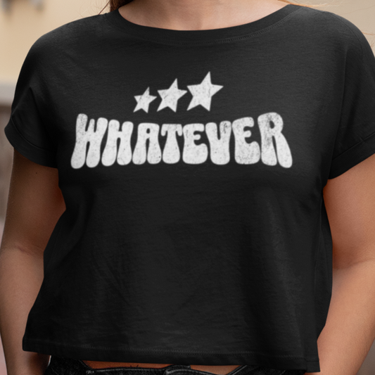 Person wearing a black t-shirt with 'WHATEVER' and star graphics.