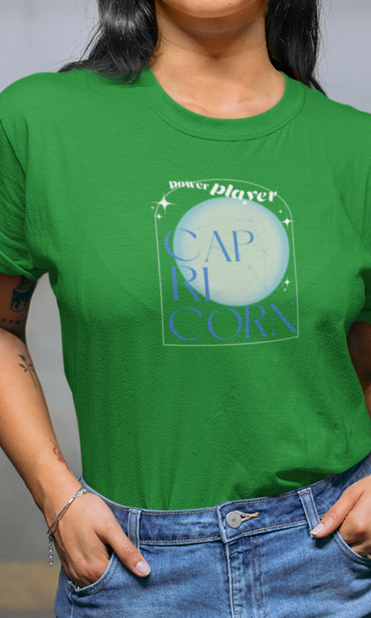 Person wearing a green t-shirt with 'Capricorn' design