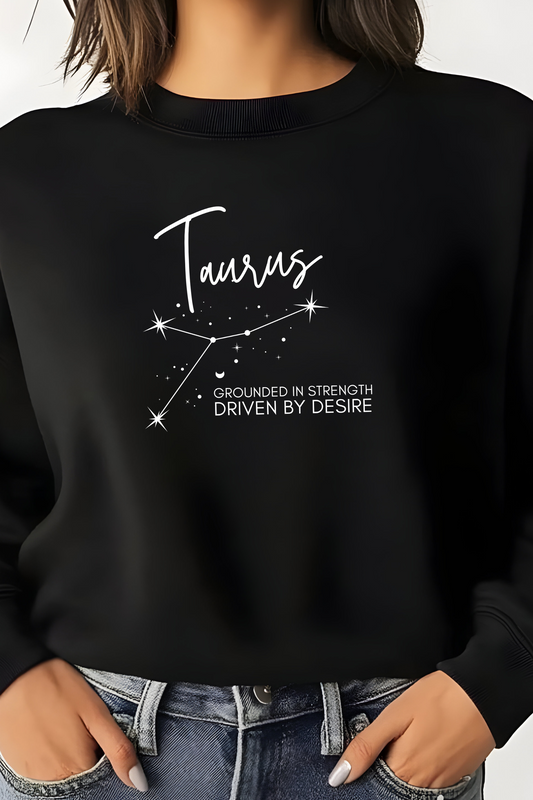 Black sweatshirt with Taurus zodiac design and text on a plain background
